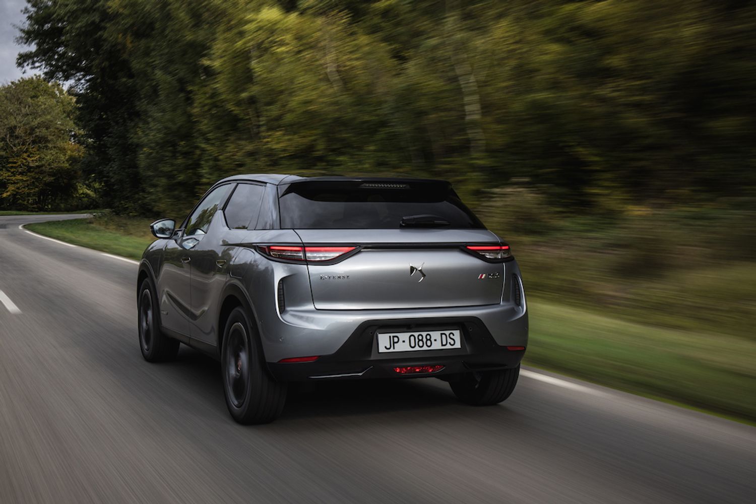 DS3 Crossback E tense exterior rear driving in forest